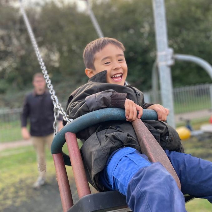 Young boy on swing