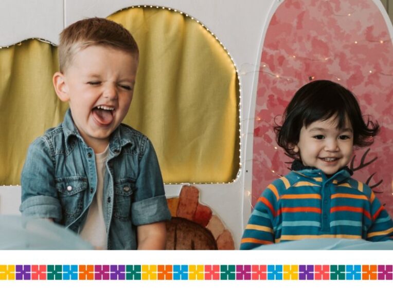 Two children laughing and playing