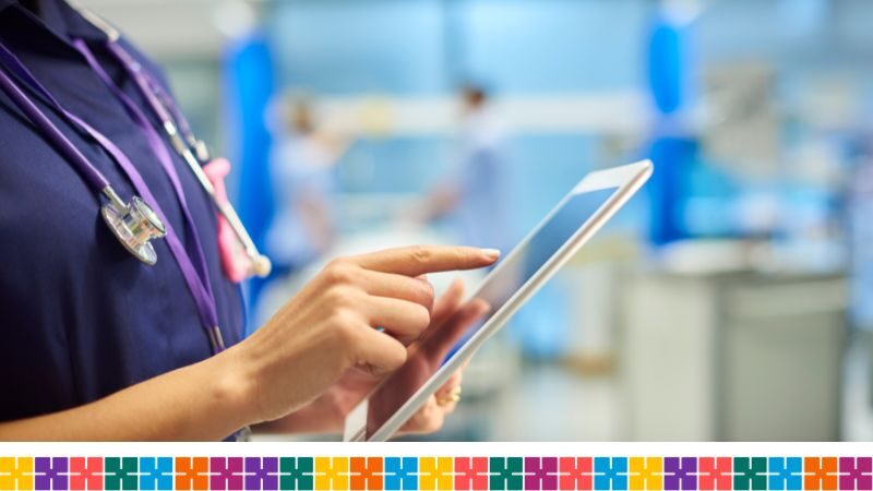 NHS staff memner with ipad