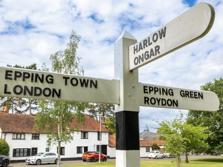 Old fingerpost signs pointing to different parts of Epping