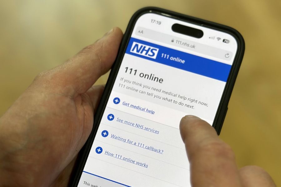 Person using smartphone to use NHS 111 online